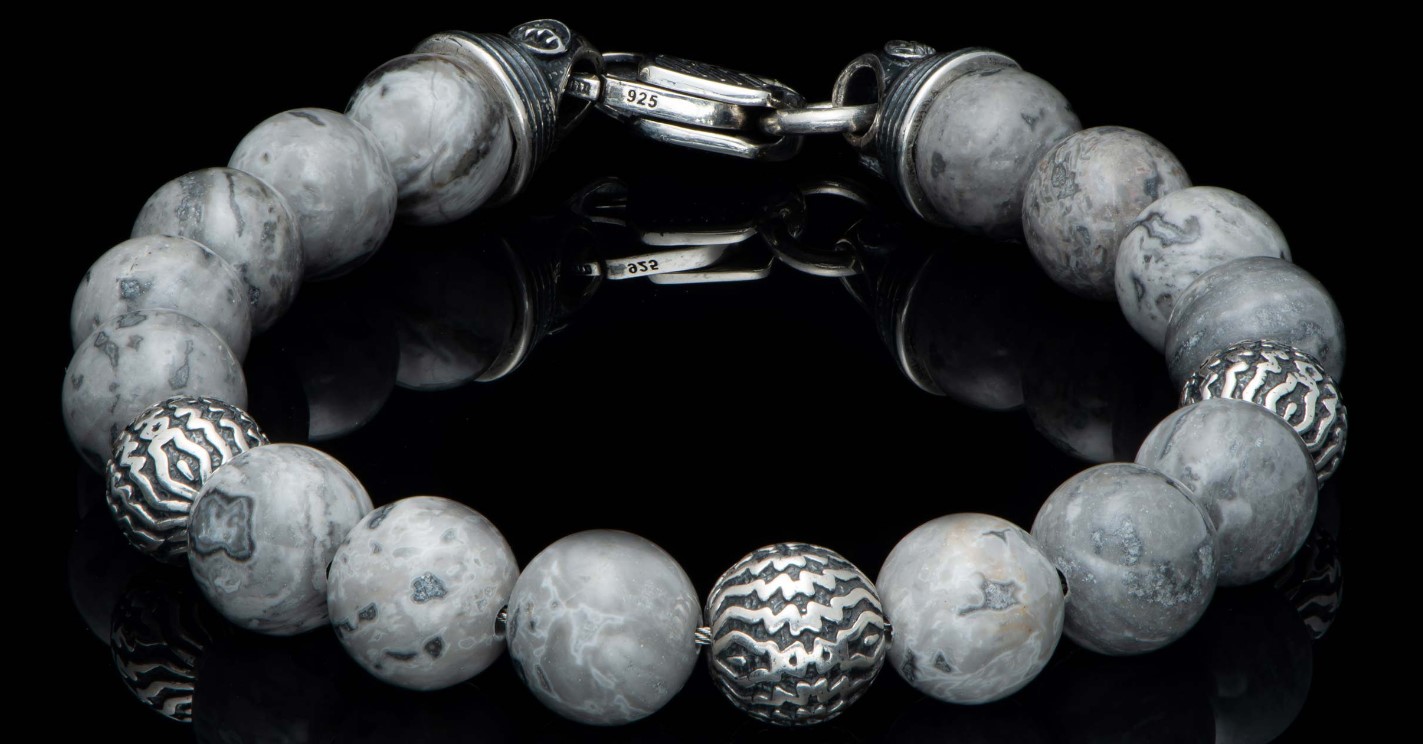 William Henry Seaside Silver Agate bracelet featuring Three finely sculpted beads in sterling silver are surrounded by the arctic granite tones of Silver Lace Agate  all threaded onto our welded stainless steel aircraft cable for durability